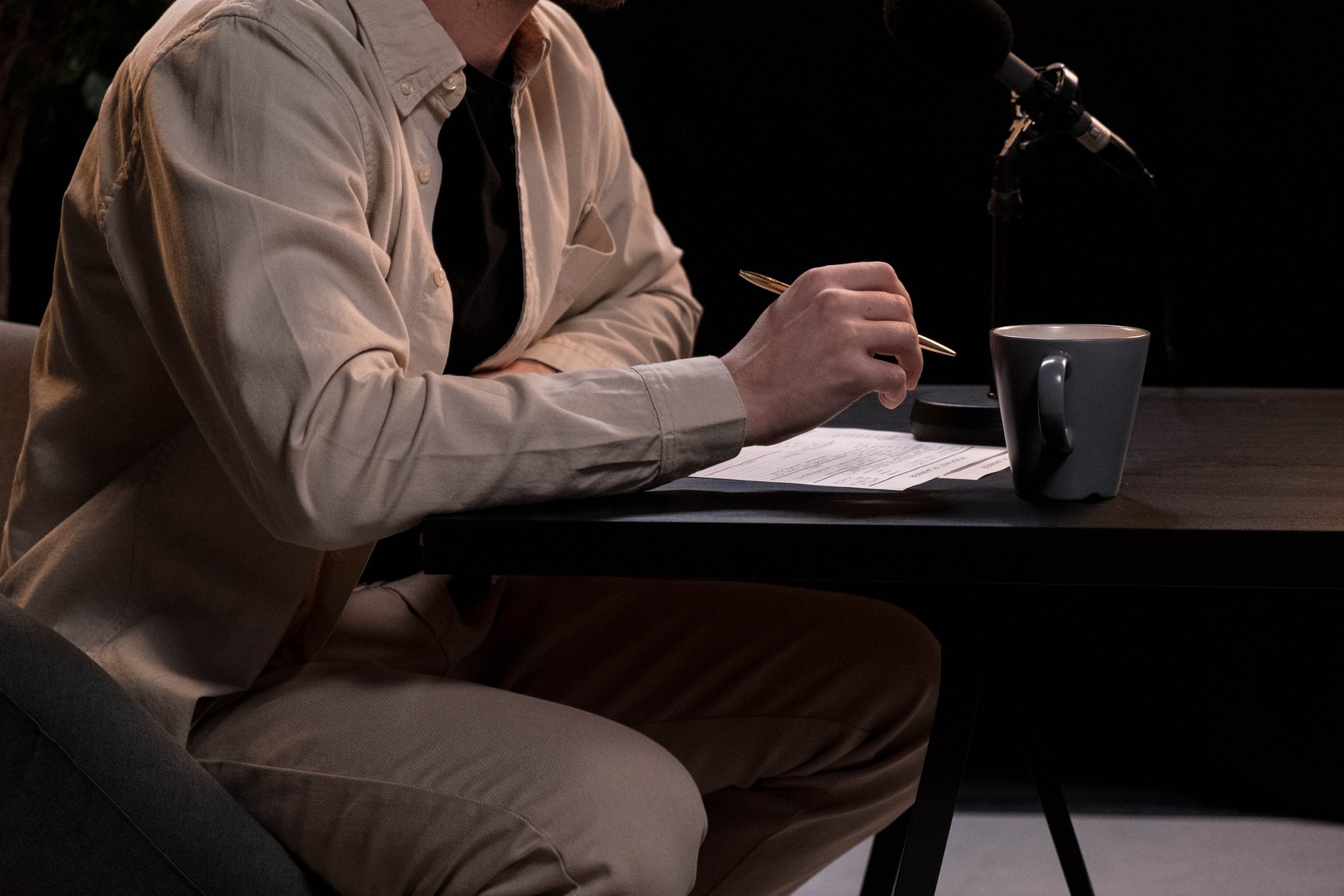 A Man at the Table holding Ballpen